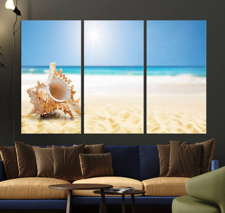 The Sea Shell on The Beach Sun Sand Wall Art Canvas Print is a triptych that beautifully captures a beach scene with a large seashell on the sand.