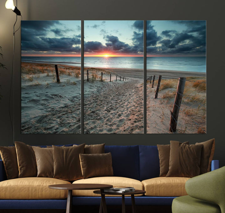 The modern living room features the Cloudy Weather Sunset Beach Wall Art Canvas Print. This museum-quality canvas adds a touch of sophistication with its hand-assembled framed art, ensuring lasting elegance. Enjoy free shipping on this exquisite piece.