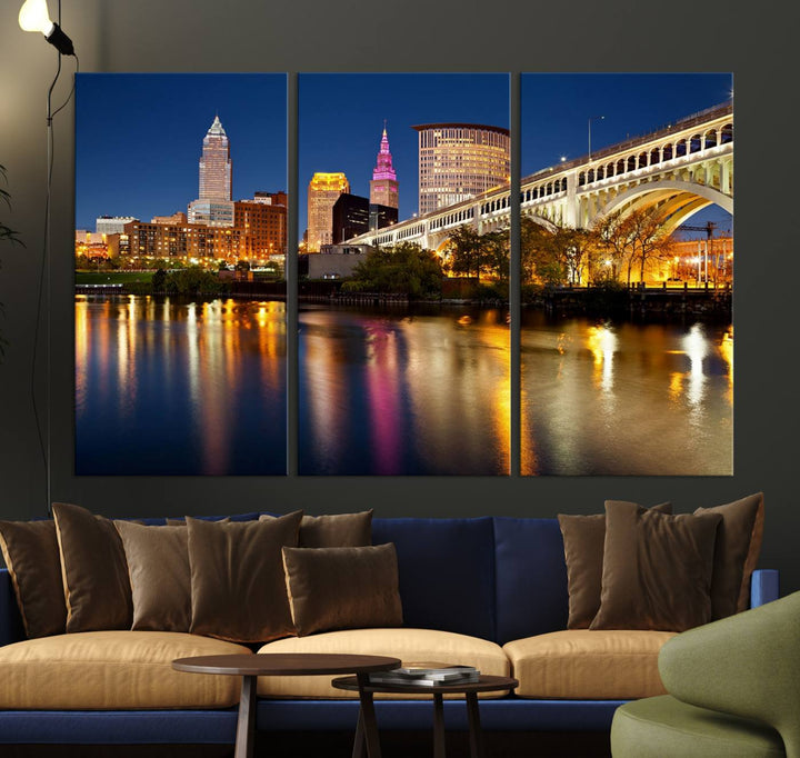 The "Cleveland Night Skyline Wall Art City Cityscape Canvas Print" is a striking feature in the room, showcasing a city skyline with a bridge reflecting in a river. Displayed on museum-quality canvas, it offers enduring beauty.