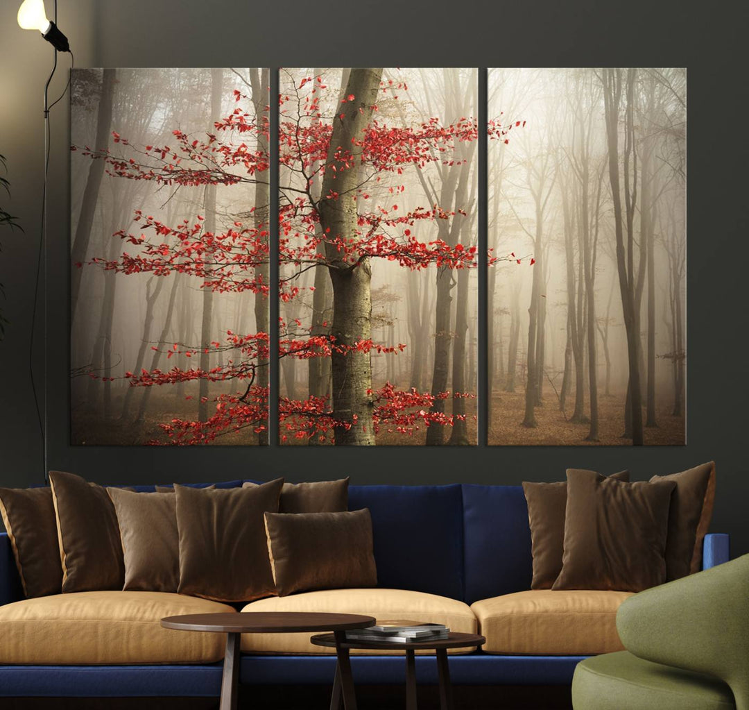 The living room features the Foggy Forest Wall Art, an Autumn Trees Canvas Print that showcases a serene nature scene with foggy woodland decor and a tree adorned in vibrant red leaves.