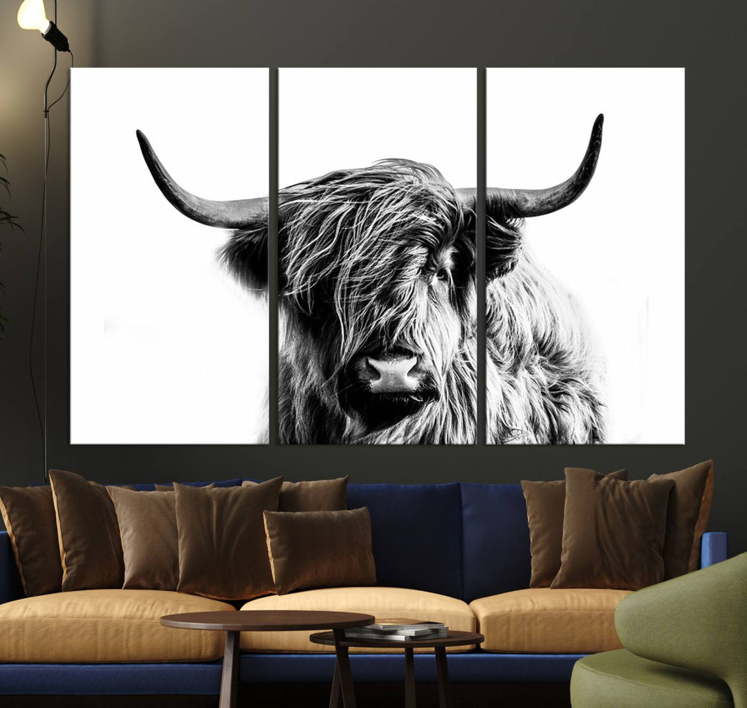 The Scottish Highland Cow Cattle Art Print Farmhouse Wall Art Canvas Print enhances rustic farmhouse decor with its depiction of a long-haired, large-horned cow. This triptych is an ideal choice for chic wall art.