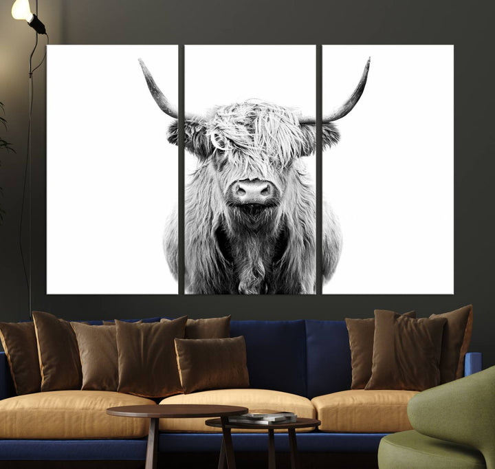 The wall art features a triptych of a Scottish Highland cow, printed on museum-quality canvases with a UV-protective coating. This decorative piece is known as the Highland Cow Canvas Wall Art Farm House Wall Art.