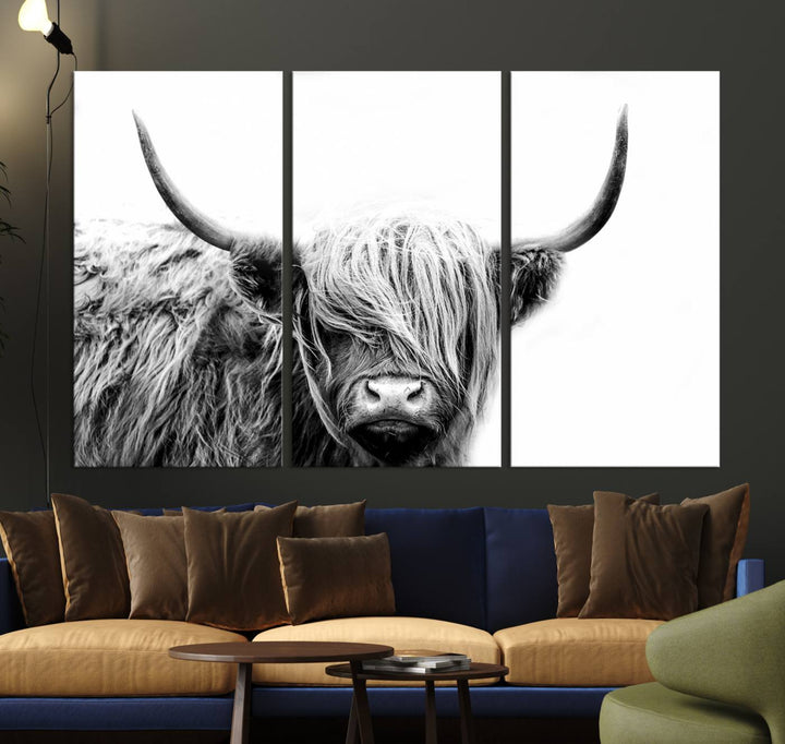 A museum-quality triptych titled "Black White Scottish Highland Cow Cattle Art Print Farmhouse Wall Art Canvas Print" embellishes the dark wall. The canvas is equipped with a UV-protective coating to ensure lasting vibrancy.