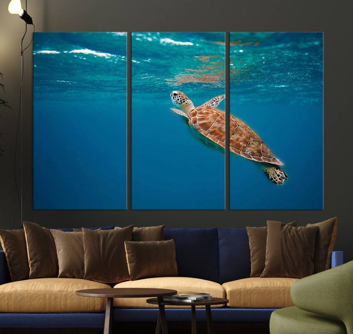 The living room features the "Baby Turtle in Ocean" wall art canvas print. This gallery-quality piece, depicting a sea turtle swimming underwater, adds an elegant touch to the space.