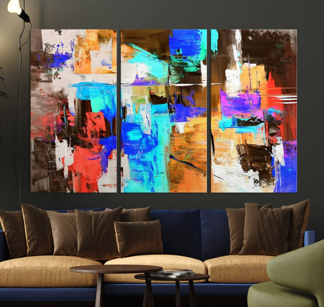 In a modern living room, the "Colorful Abstract Wall Art Canvas Print" serves as a stunning triptych centerpiece on museum-quality canvas, ready to hang. Its UV-protective coating ensures enduring vibrancy.