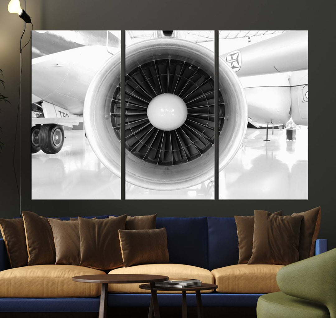 The "Jet Motor Wall Art Canvas," featuring a black and white image of an aircraft engine, is hung on the wall.