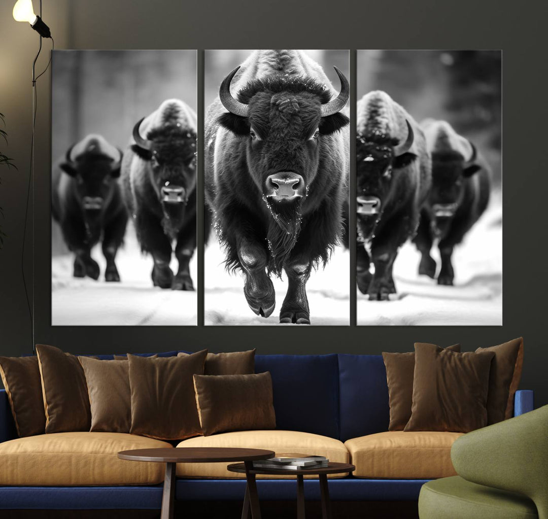 A modern living room features a striking black-and-white American Bison Art | Buffalo Herd Wall Art Canvas Print on the wall.