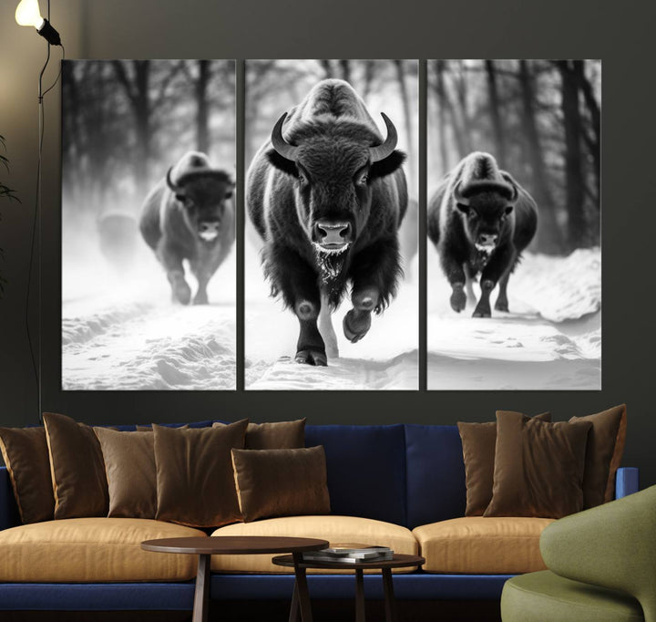 Transform your living room with the Buffalo Wall Art Canvas Print triptych, showcasing a bison family in motion across a snowy landscape. This striking Western decor piece becomes the focal point of any room.