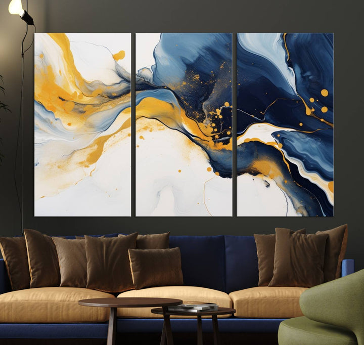 The Blue and Gold Abstract Fluid Canvas Art, with its swirling patterns, adorns the wall. This modern wall art beautifully complements the contemporary interior decor, adding an elegant touch with its rich blue, gold, and white tones.