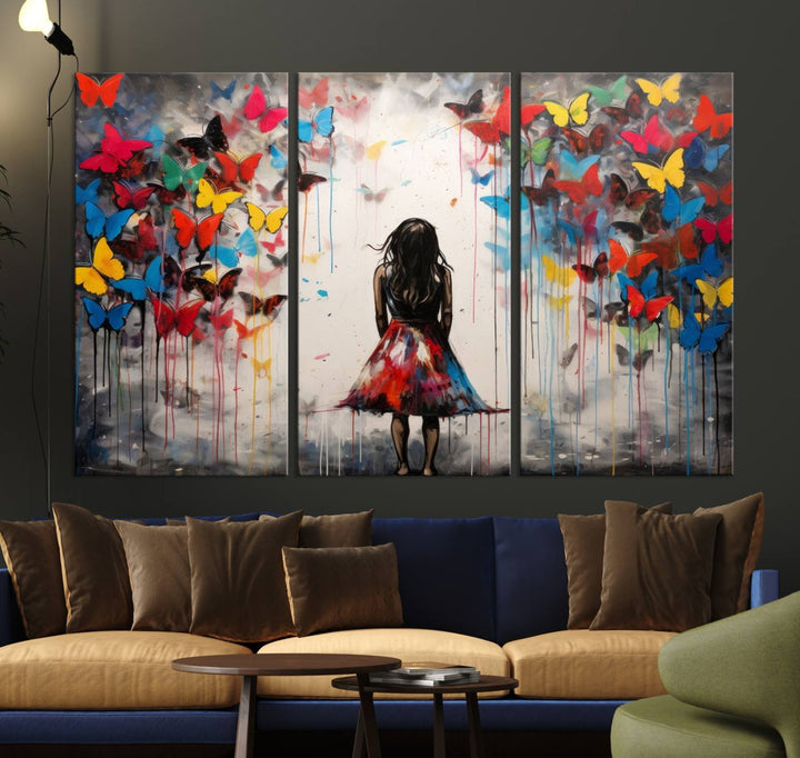 The Girl Butterfly Graffiti Abstract Canvas Print, featuring a vibrant depiction of a girl surrounded by butterflies on museum-quality canvas, is displayed prominently.