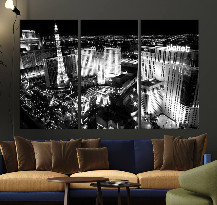 The Las Vegas Wall Art Canvas Print is a black and white triptych that showcases a city skyline at night. Crafted on museum-quality canvas with a UV-protective coating, it serves as an elegant and ready-to-hang focal point in the room.