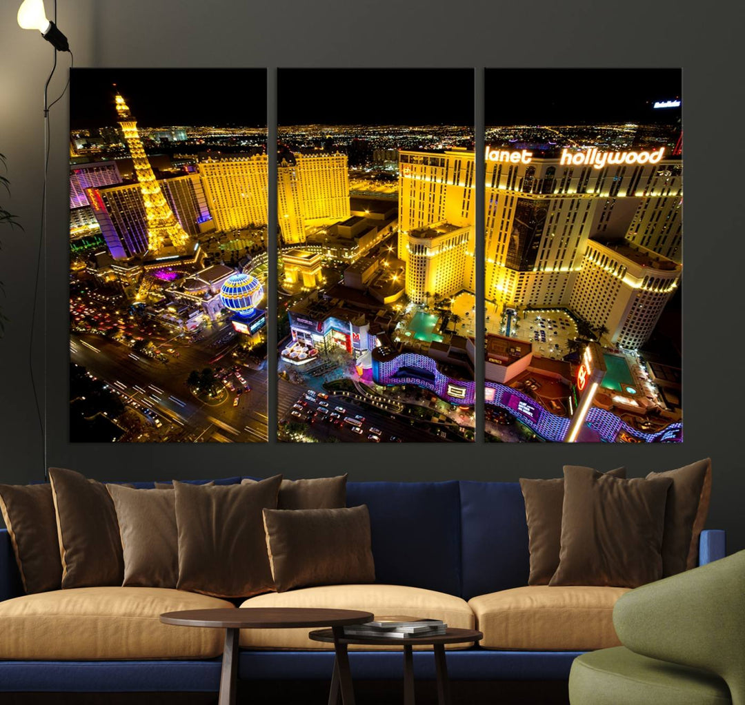 The modern living room features a Las Vegas Wall Art Canvas Print, a museum-quality triptych showcasing a vibrant cityscape with neon lights.