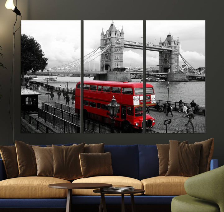 The London Red Bus and Bridge Wall Art Canvas Print showcases a red London bus in front of Tower Bridge, beautifully presented as a gallery-wrapped canvas. This striking image is divided into three panels, delivering a museum-quality display that's ready to hang.