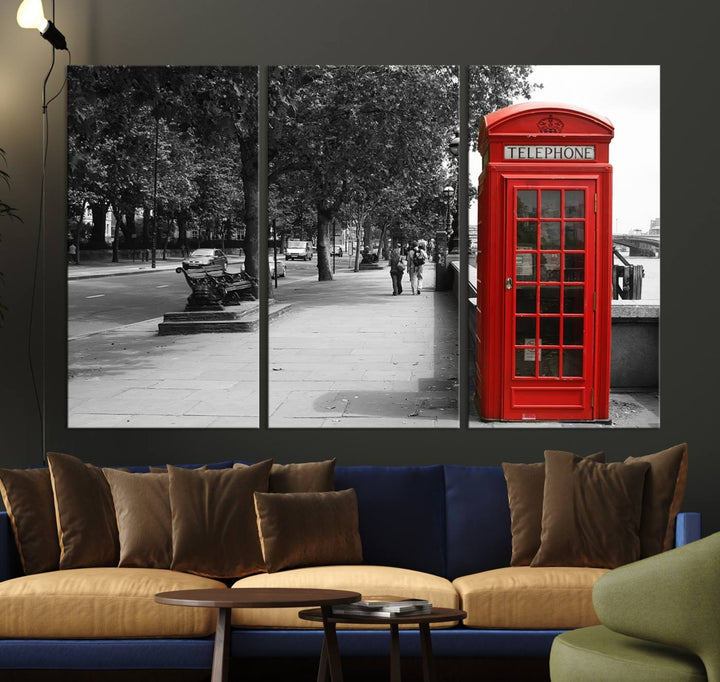 The London Phone Club Wall Art is a stunning piece that showcases a red telephone box set in a black and white street scene on museum-quality canvas. It is gallery wrapped with a UV-protective coating to preserve its vibrant charm.