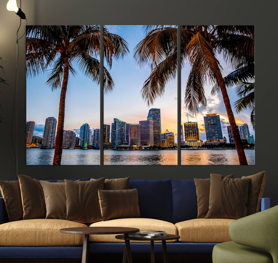 The Wall Art MIAMI Canvas Print features a triptych design depicting palm trees and a city skyline at sunset.