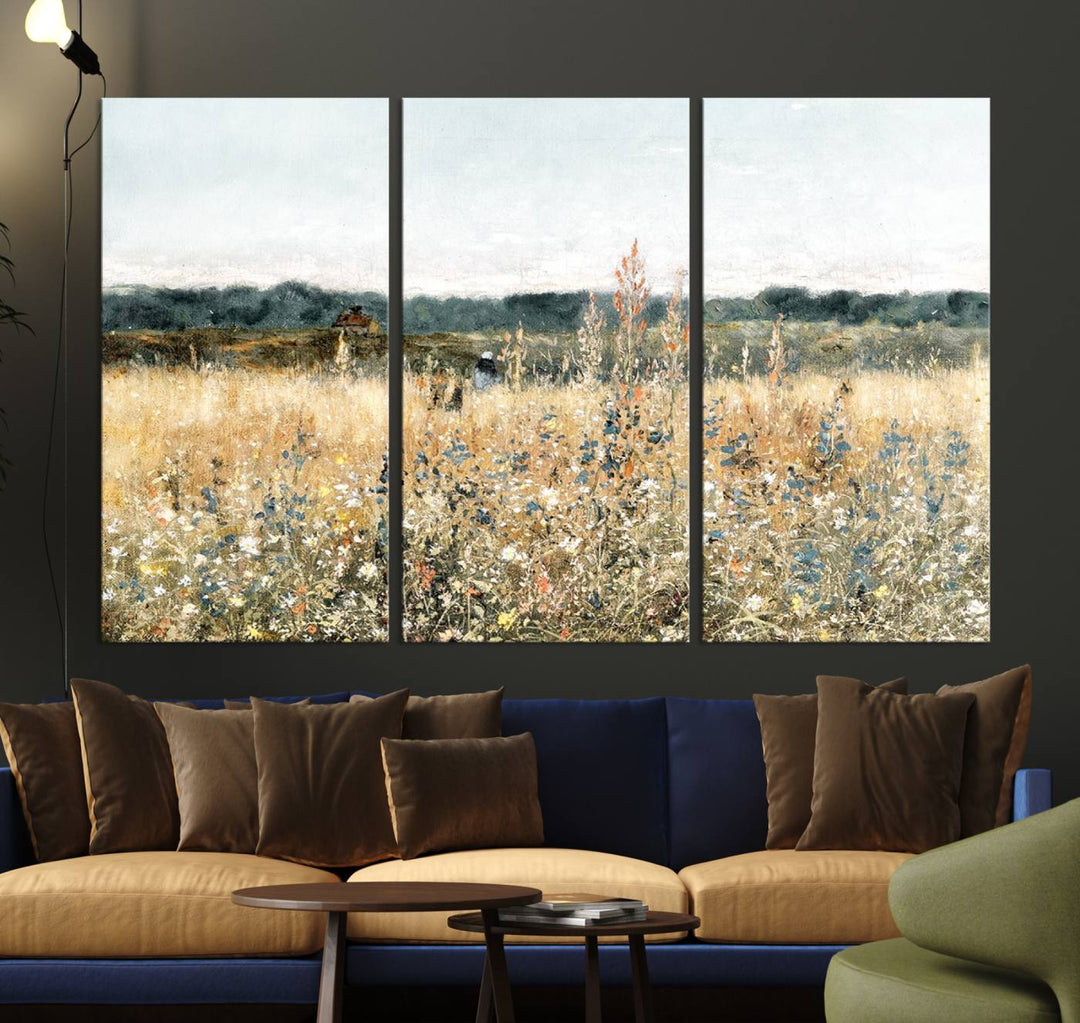 The "Wildflower Field Wall Art Canvas" brings rustic charm to the room with its nature-inspired landscape print, making it a perfect addition to the living room or office.