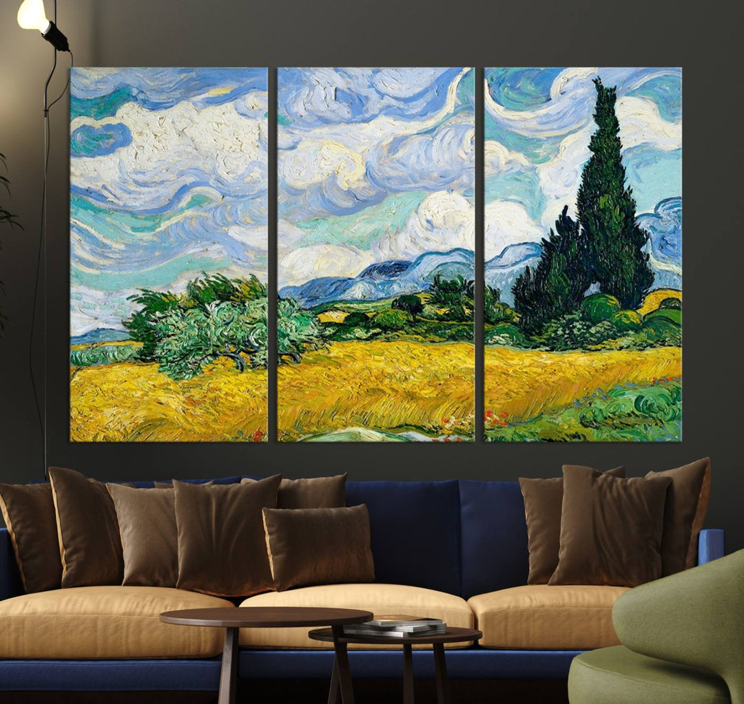 A contemporary living room features a large triptych of "Wheatfield With Cypresses By Van Gogh Painting Wall Art Canvas Print." Crafted on museum-quality canvas, this artwork brings a sense of elegance and craftsmanship reminiscent of professional artistry.