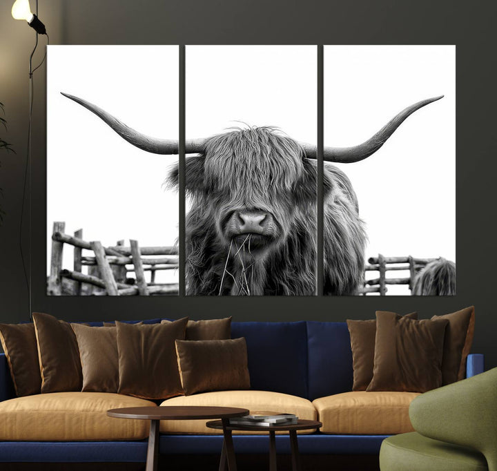 The Longhorn Canvas Print, featuring a black-and-white triptych of a Bighorn cow with shaggy fur and impressive long horns, is elegantly showcased. This wall art piece boasts a gallery-quality finish on premium canvas, bringing sophistication to any room.