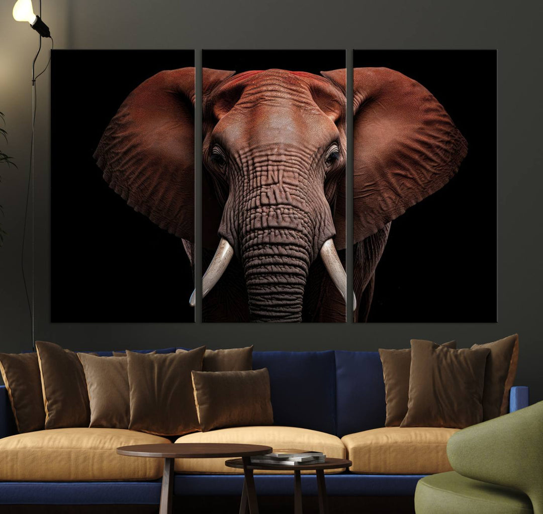 A stunning triptych titled "Wild Elephant Wall Art Canvas Print" beautifully enhances the wall above a contemporary living room. This Africa Savannah Wild Animal Wall Decor Print is of museum-quality, complete with a UV-protective coating to ensure its vibrancy and beauty are preserved for years.