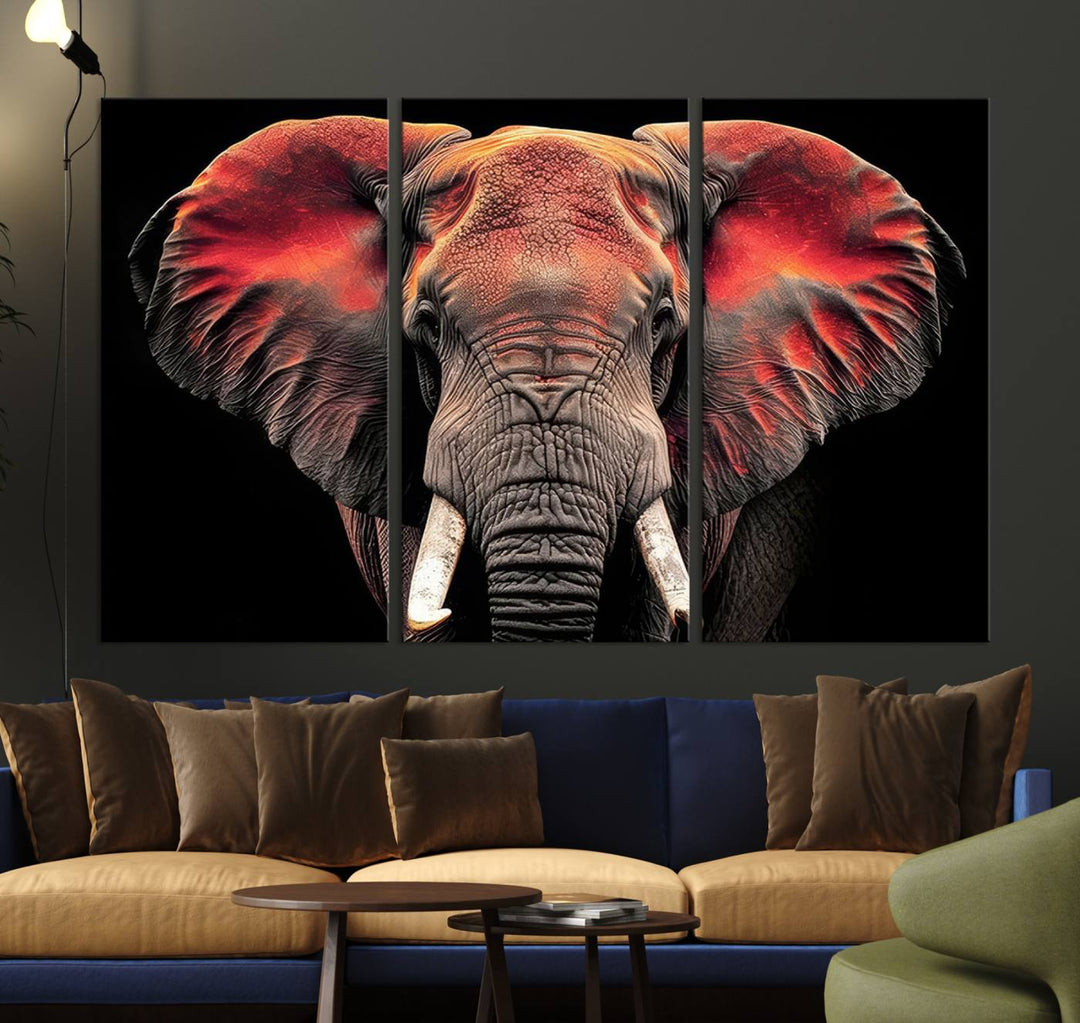 The Elephant Wall Art Canvas Print, featuring vibrant red and black tones, is a stunning artwork printed on museum-quality canvas. It comes with a UV-protective coating.