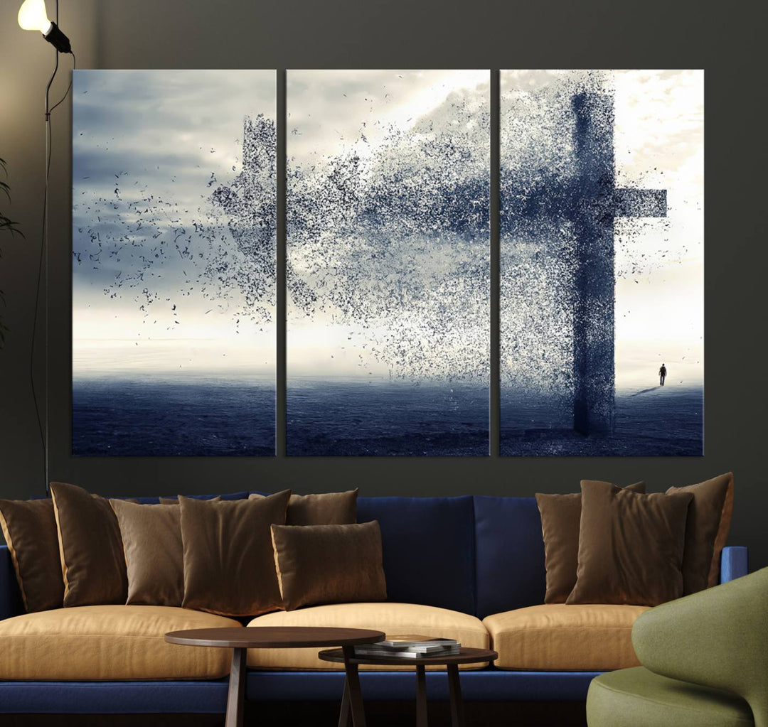 The "Jesus and the Fading Cross – Symbol of Faith" framed canvas print beautifully depicts a cross formed by birds against a moody sky above an ocean. This piece of Christian wall art infuses spirituality into the minimalist space.