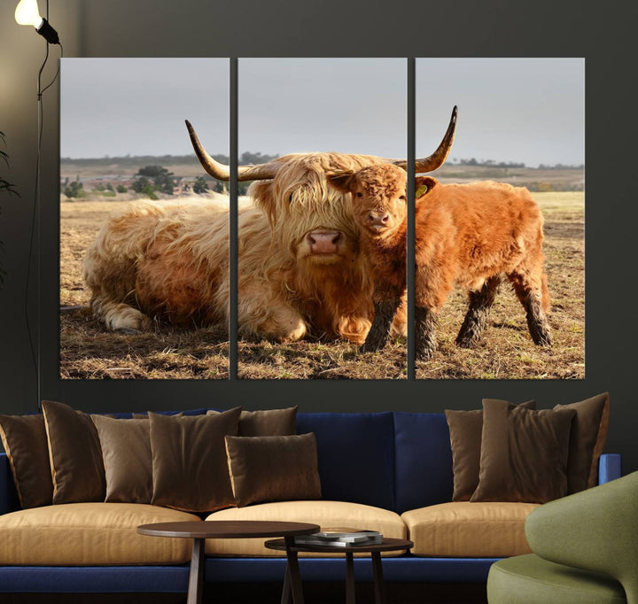 The three-panel canvas artwork, titled "Highland Cow Canvas Wall Art Animal Print for Farm House Decor," features a serene scene of a resting Highland cow and calf in a field. The piece highlights its gallery-quality finish.