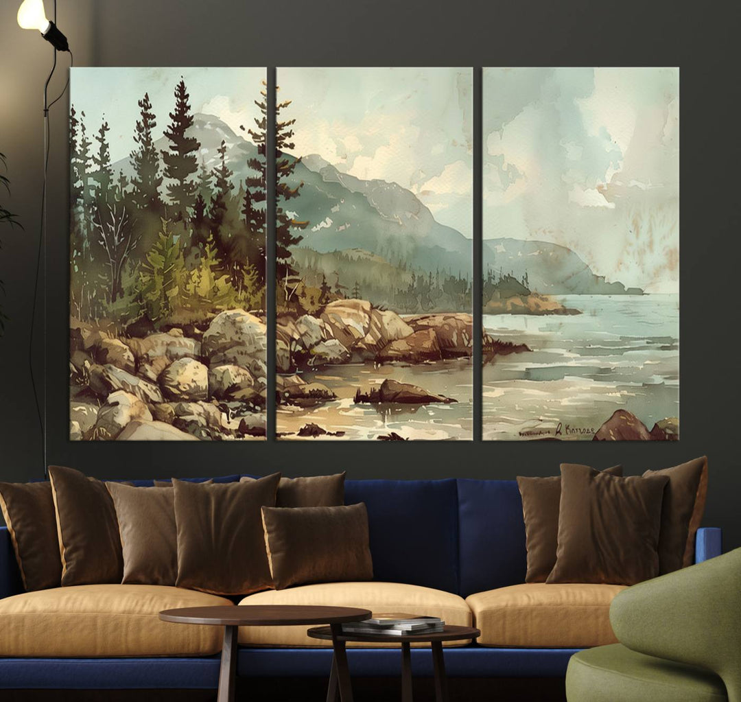 The living room features a breathtaking three-panel Abstract Acadia National Park Wall Art Canvas Print, which beautifully captures the rocky Maine coastline with trees and mountains.