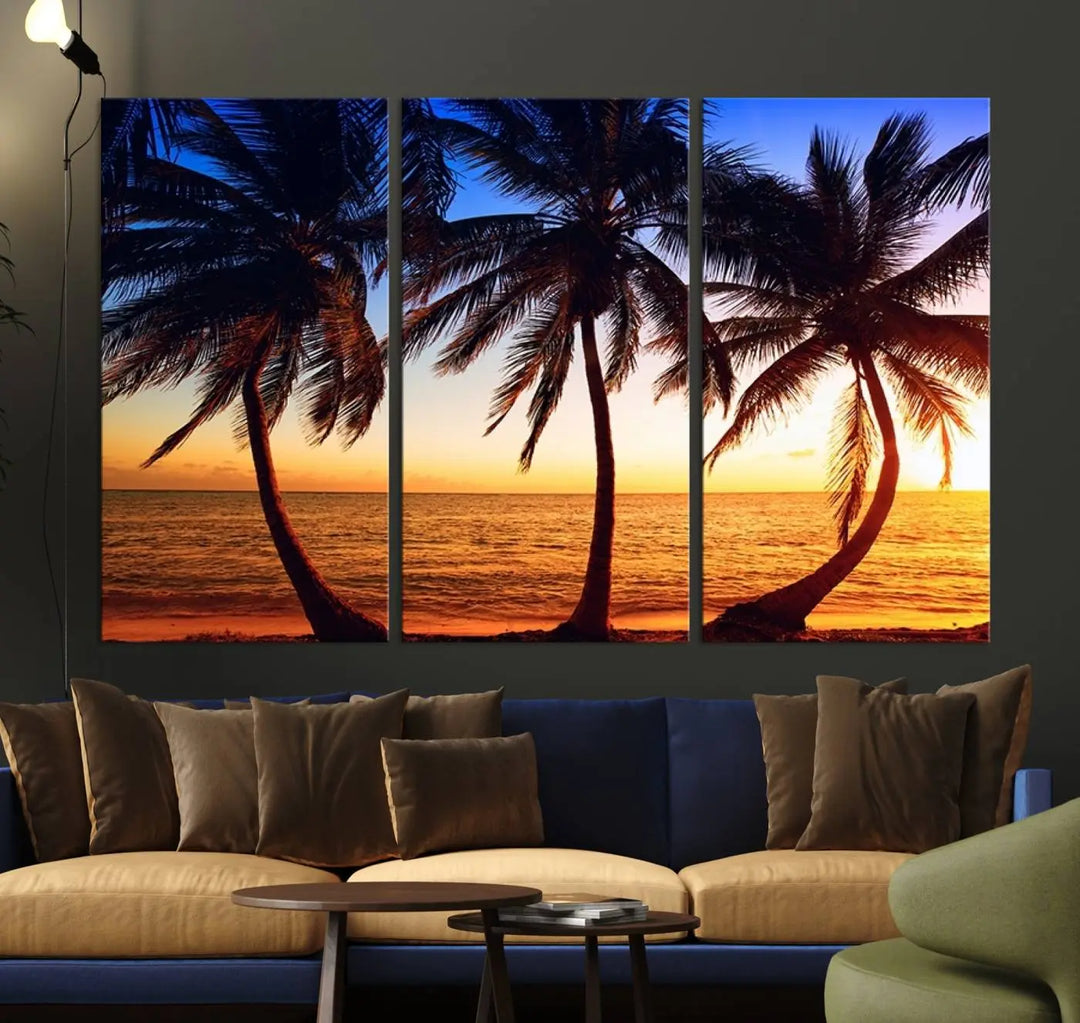 The living room features a wall adorned with the "Wall Art Canvas Curve Palms at Sunset on Beach," showcasing gallery-wrapped, museum-quality canvases in a stunning triptych.