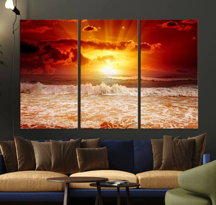 In a modern living room, the vibrant "Wall Art Canvas Perfect Sunset Turns Colour of Sea and Sky to Red," printed on museum-quality canvas, stands out. A floor lamp casts warm light over the ready-to-hang artwork, which includes a UV-protective coating to ensure lasting brilliance.