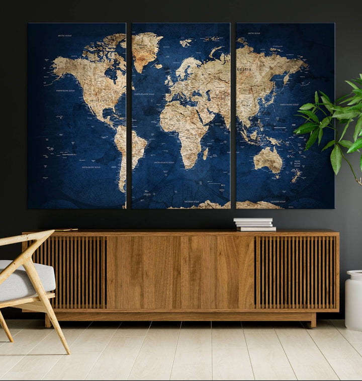 A triptych canvas print titled "Vintage Blue World Map Canvas Print - Classic World Map Design on Deep Blue Wall Art Print" adorns the wall, enhancing the decor with its antique style.