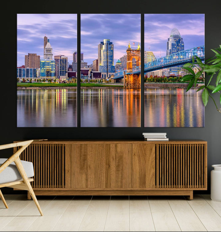 The wall art titled "Cincinnati City Lights Sunset Purple Cloudy Skyline Cityscape View" is beautifully printed on museum-quality canvases with a UV-protective coating and is ready to hang.