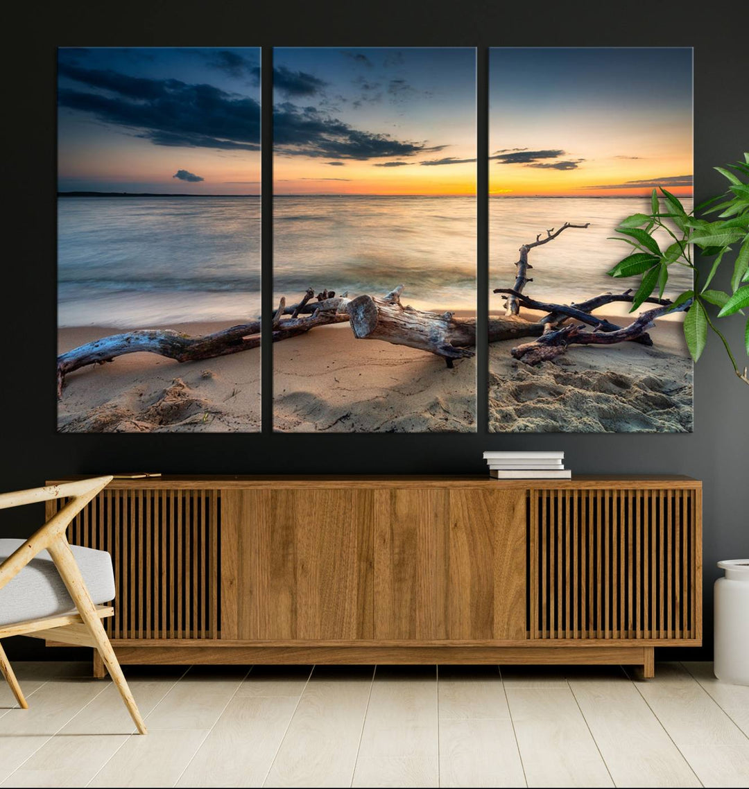 A captivating piece of Ocean Sunset Beach Wall Art Canvas Print, gallery wrapped, graces the gray wall.