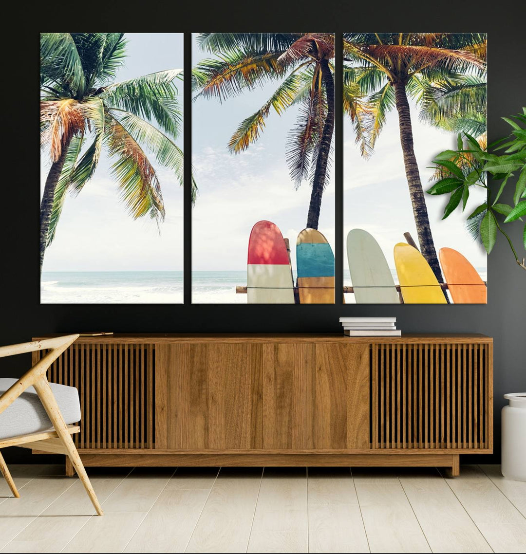 The room showcases The Palm and Surfing Board Wall Art Canvas Print, a triptych of palm trees and surfboards by the beach, elegantly gallery wrapped for a sophisticated finish.