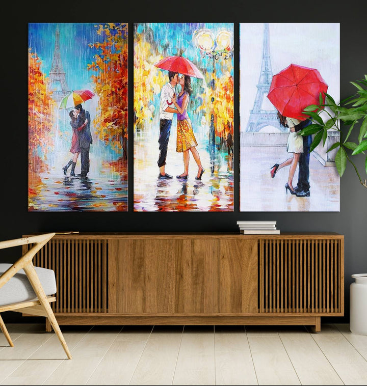 A triptych of the "Love in Paris Wall Art Canvas Print" showcases a couple with an umbrella in romantic settings. This artwork is crafted on museum-quality canvas and features a UV-protective coating for peace of mind. It also comes with the added convenience of free shipping.