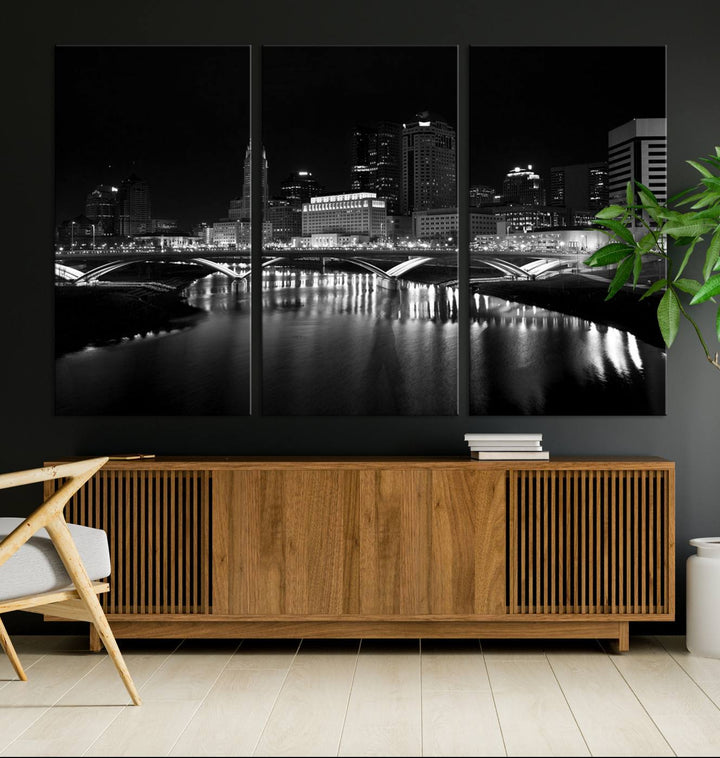 The living room features the "Columbus City Lights Skyline Black and White Wall Art Cityscape Canvas Print" above a coffee table. This artwork is presented as a triptych on museum-quality canvases with UV-protective coating.