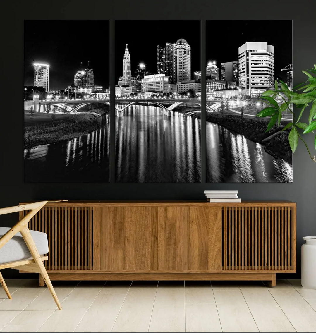 The living room showcases the Columbus City Lights Skyline Black and White Wall Art Cityscape Canvas Print.