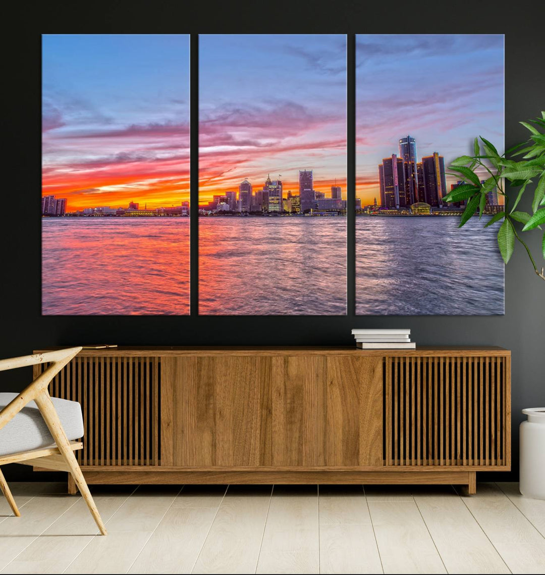 The Detroit City Lights Sunset Colorful Cloudy Skyline Cityscape View Wall Art Canvas Print showcases a vibrant city skyline at sunset over water. The artwork is museum-quality, comes ready to hang, and features a UV-protective coating to preserve its vivid colors.