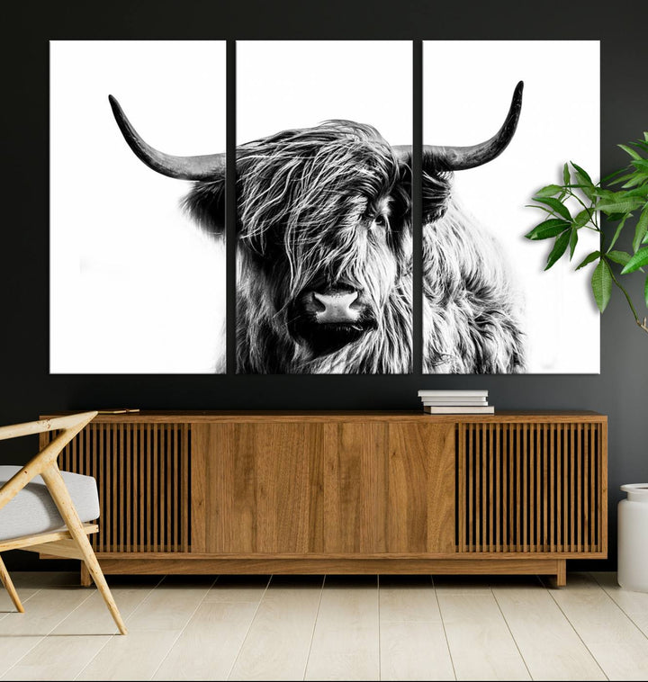 The Scottish Highland Cow Cattle Art Print Farmhouse Wall Art Canvas Print enhances rustic farmhouse decor with its depiction of a long-haired, large-horned cow. This triptych is an ideal choice for chic wall art.