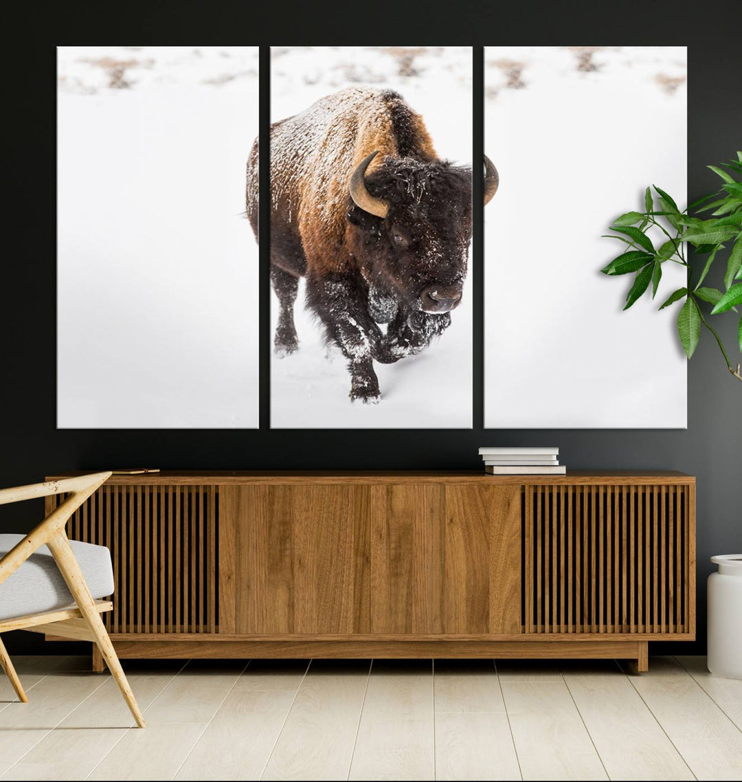 The Bison Winter Wall Art Canvas Print for Farmhouse Decor is displayed as a triptych in the living room. This artwork, printed on museum-quality canvases with a UV-protective coating to maintain its vibrant colors, is the focal point of the space.