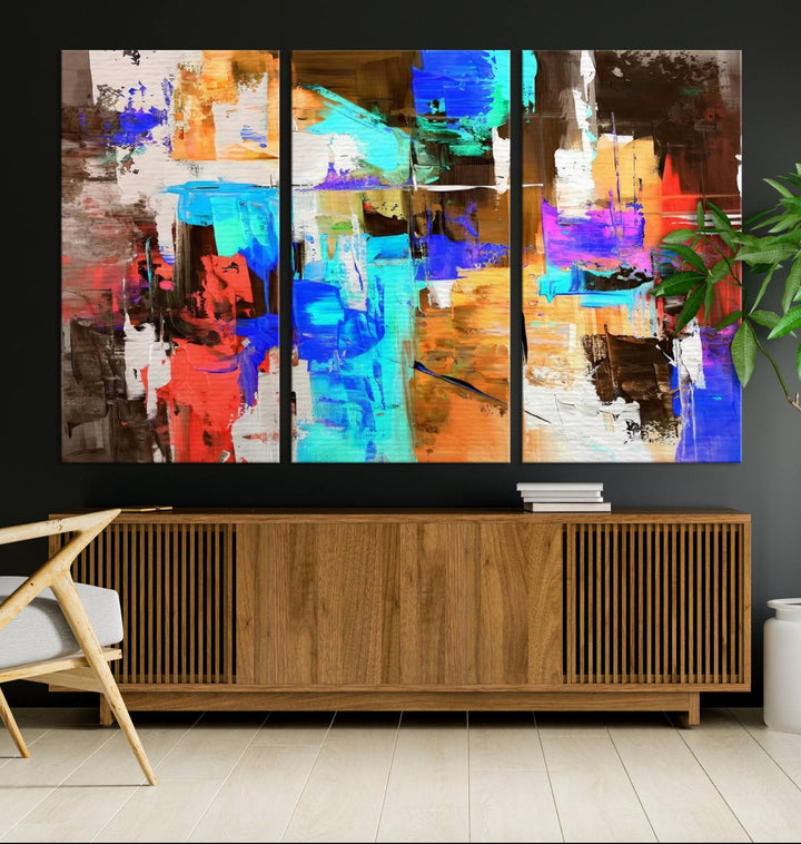 In a modern living room, the "Colorful Abstract Wall Art Canvas Print" serves as a stunning triptych centerpiece on museum-quality canvas, ready to hang. Its UV-protective coating ensures enduring vibrancy.