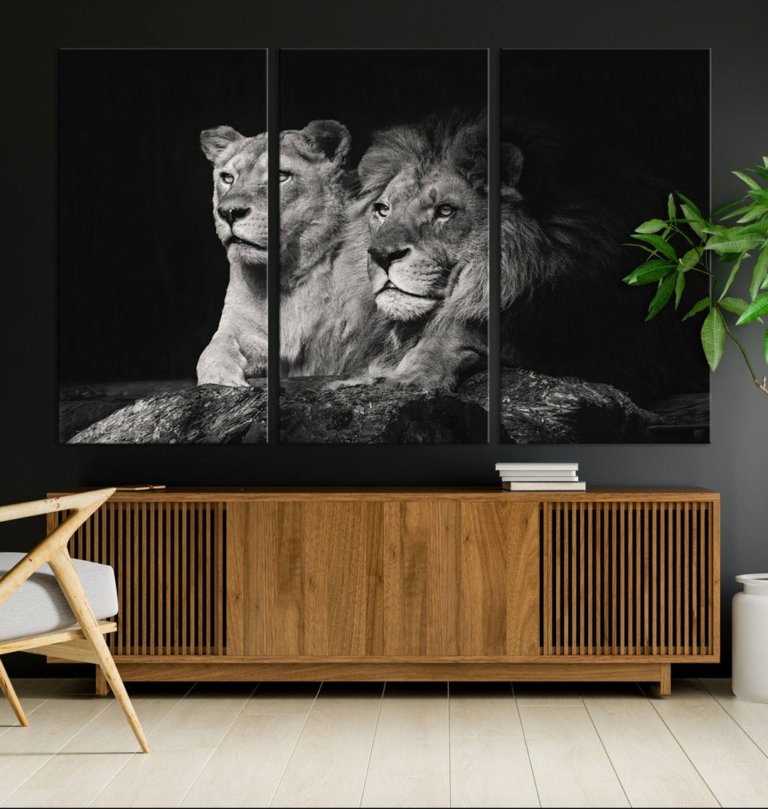 The elegant wildlife portrait, "Lion Couple Canvas Wall Art Print," featuring a black and white depiction of a lion family, majestically decorates the living room wall.