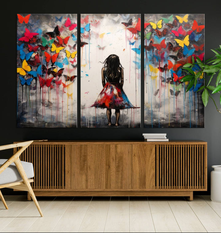 The Girl Butterfly Graffiti Abstract Canvas Print, featuring a vibrant depiction of a girl surrounded by butterflies on museum-quality canvas, is displayed prominently.