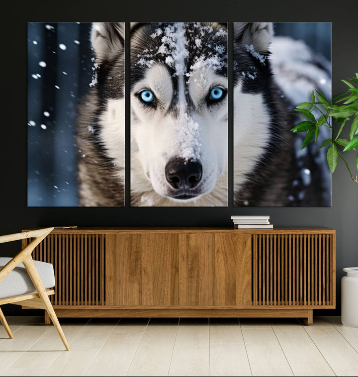 A digital art piece titled "Winter Siberian Husky Wolf Wall Art Canvas Print" showcases a blue-eyed husky blanketed in snow. Printed on high-quality canvas, it is an ideal choice for nature and dog enthusiasts.