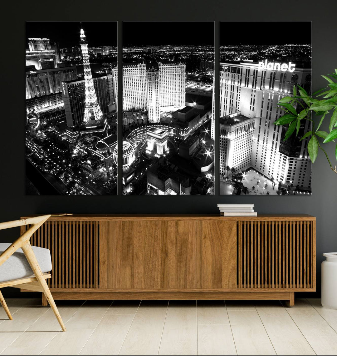 The Las Vegas Wall Art Canvas Print is a black and white triptych that showcases a city skyline at night. Crafted on museum-quality canvas with a UV-protective coating, it serves as an elegant and ready-to-hang focal point in the room.