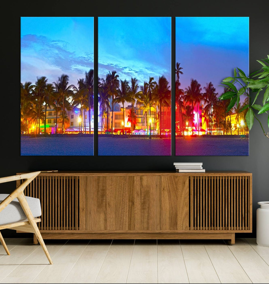 The living room features a three-panel Miami City Wall Art Canvas Print, showcasing a colorful, illuminated beach scene with palm trees on museum-quality canvas.