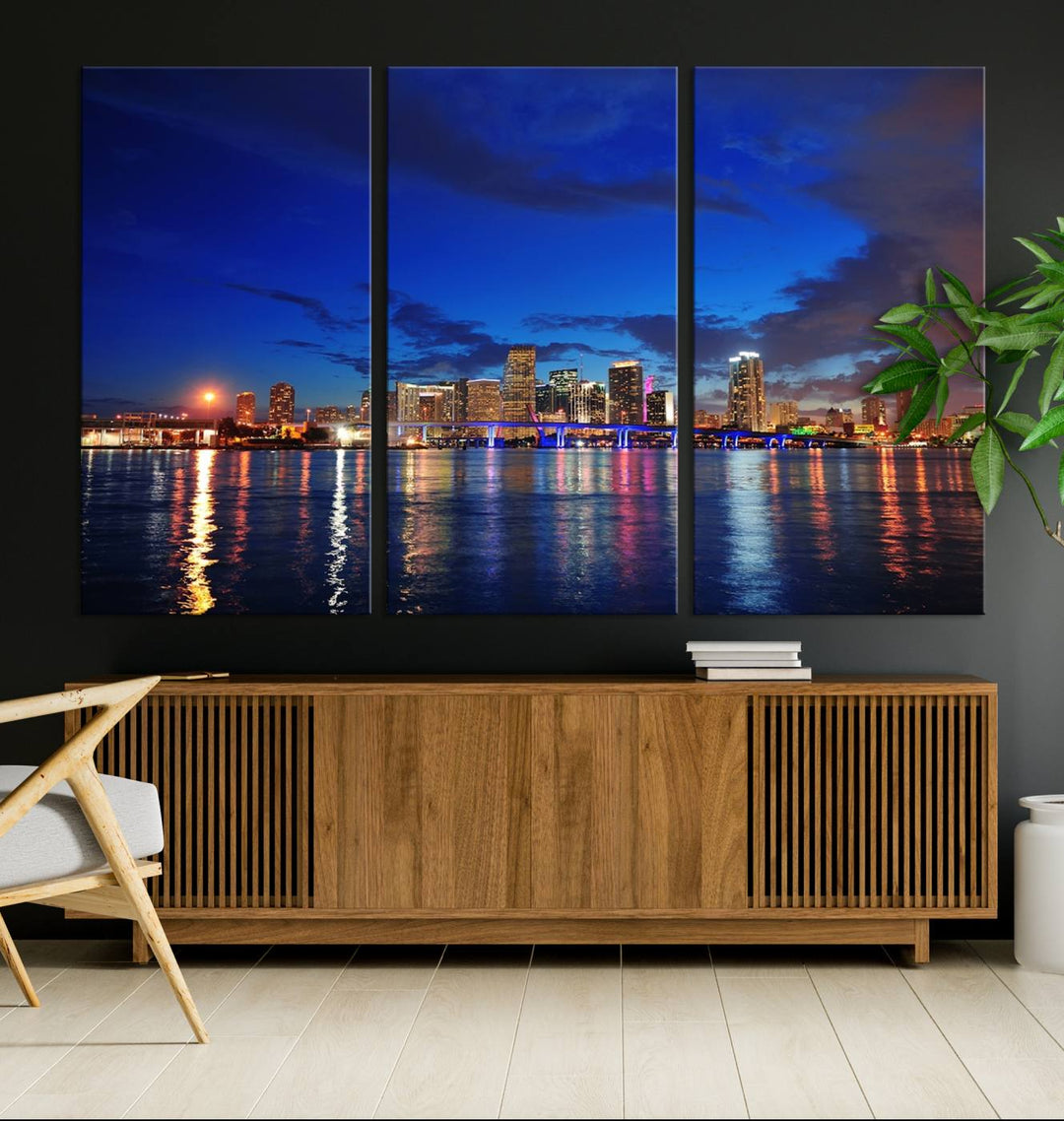 A large Miami City View Wall Art Canvas Print featuring the Miami City Skyline Panorama at night is displayed above the dresser.