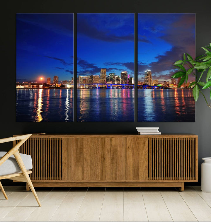 A large Miami City View Wall Art Canvas Print featuring the Miami City Skyline Panorama at night is displayed above the dresser.