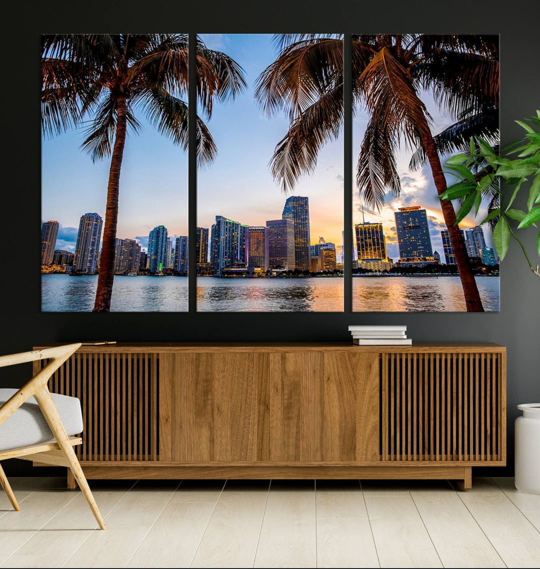 The Wall Art MIAMI Canvas Print features a triptych design depicting palm trees and a city skyline at sunset.