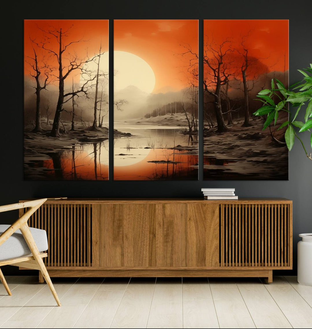 The "Abstract Watercolor Trees and Sunset on Lake Wall Art" is a triptych masterpiece, showcasing an orange-hued landscape of barren trees and a large sun. Displayed on museum-quality canvases with UV-protective coating, it creates a striking visual element in any space.