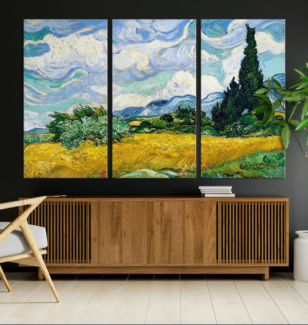 A contemporary living room features a large triptych of "Wheatfield With Cypresses By Van Gogh Painting Wall Art Canvas Print." Crafted on museum-quality canvas, this artwork brings a sense of elegance and craftsmanship reminiscent of professional artistry.